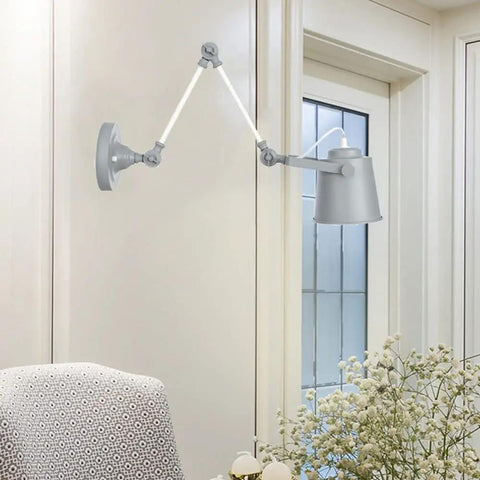 Real Deal Nordic Metal Swing Arm Wall Sconce Adjustable Task Light With Heavy Gauge Body E27 Compatible Easy Install For Bedroom Hallway Living Room Top Pick Gray White Finish mounted beside an armchair.