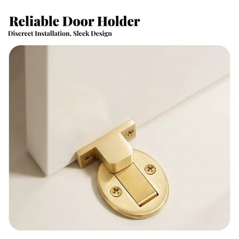 Reliable door holder in gold metal with discreet installation, part of a heavy duty floor door catch black design.