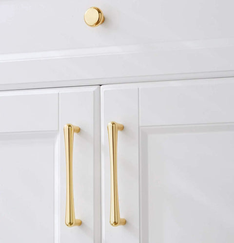 Top Shelf Heavy Gauge Zinc Alloy Cabinet Pulls Bow Handles Set Of Two Swanky Premium Electroplated Gold on white cabinetry.