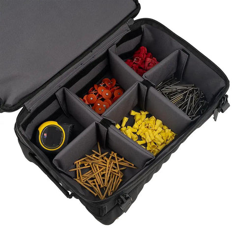 Open view of Pro Drop-Bottom Tool Bag with 15 compartments holding assorted fasteners and a measuring tape, waterproof bottom visible.