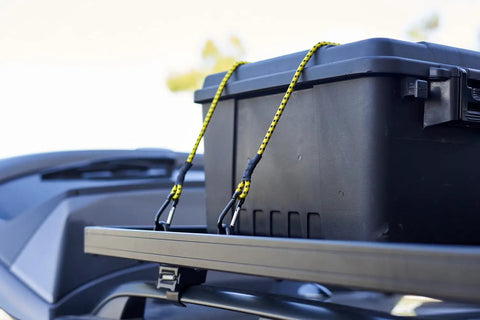 Heavy Duty Carabiner Bungee Cords Set, 12 Pack In Assorted Colors And Sizes securing black storage box on vehicle rack