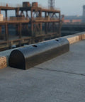 Semi Circular Black Rubber Dock Guard Extruded Protector on concrete dock in marine setting
