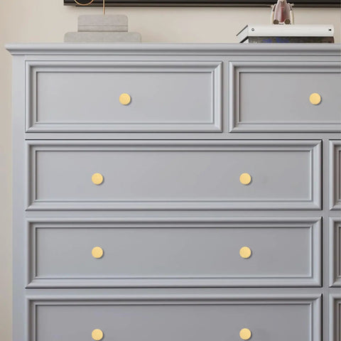Gray dresser with Solid Brass Round Cabinet Knobs 4 Pack, Beefy Yet Sleek Dresser Drawer Pulls installed, gold finish.