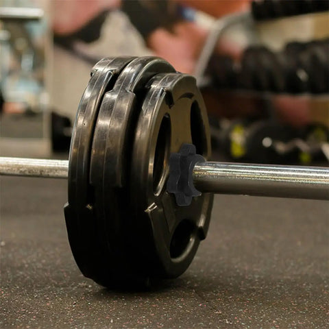 Close-up of 8 Pack Dumbbell Bar Collars Clips For Fitness Equipment, Plastic Screw Clamps securing weights on a dumbbell bar.