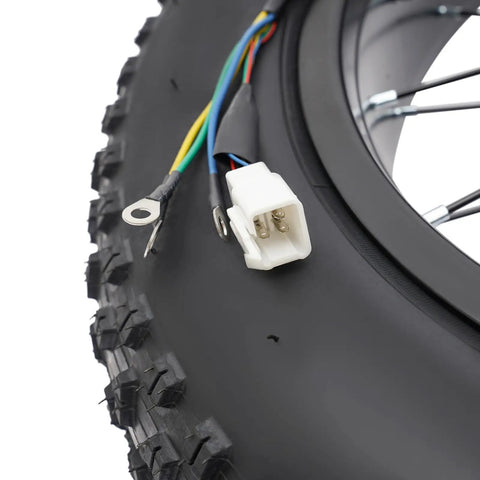 Close-up of Beefed Up 1500W 48V Ebike Conversion Kit with 20 inch rear hub motor wiring connectors and tire tread detail.