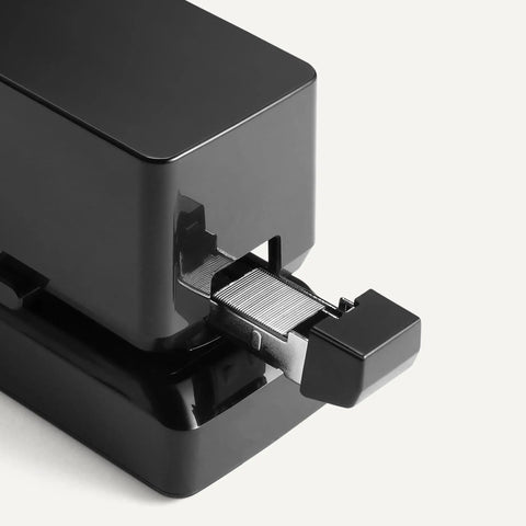 Close-up of The Real Deal Electric Automatic Stapler For Desk Grind Crushing Through 25 Sheets Without Jamming showing motorized mechanism.