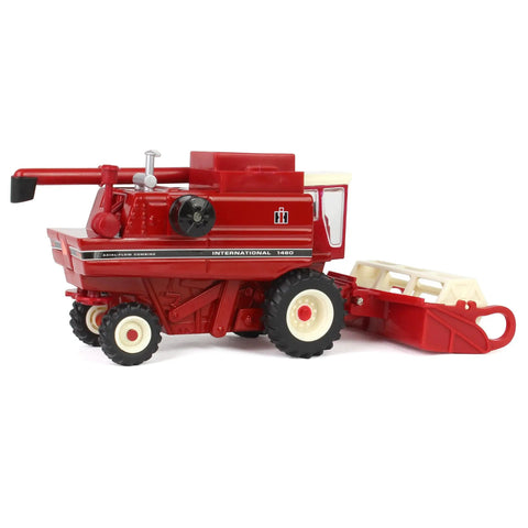 Side view of International Harvester 1460 Combine Die Cast Model One Sixty Fourth Scale With Rear Wheel Assist and Corn Head.