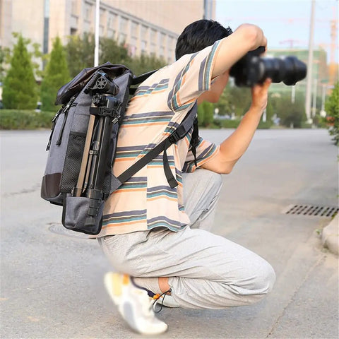Photographer using Waterproof DSLR Camera Backpack With Large Capacity And Anti Theft Design Reflector Stripe Detachable Tripod Strap