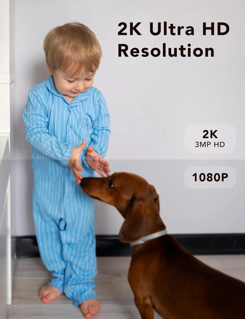 Child in pajamas greeting a dog, showcasing 2K Ultra HD resolution from security camera, ideal for monitoring indoors.