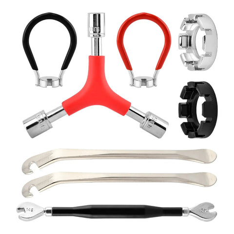No Sweat Road Warrior Bike Repair Kit Featuring Five Universal Spoke Wrenches Two Heavy Duty Tire Levers And One Y Shaped Socket Adapter showing tools laid out.