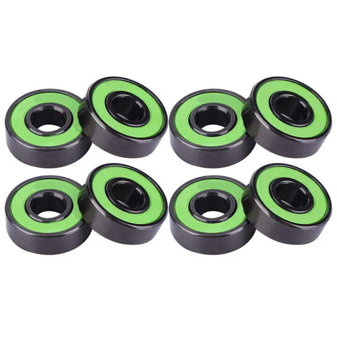 Premium Chrome Steel Skateboard Bearings With Extended Inner Ring For Zero Wobble And Razor Sharp Alignment, Shred Ready For fast longboarding, showing green and black bearing set.