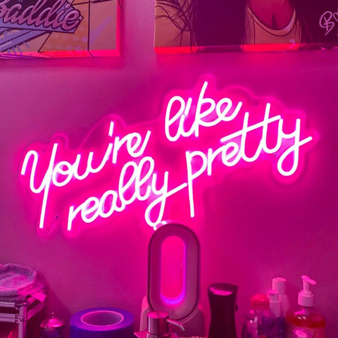 "You're like really pretty" pink neon sign on wall, 25.5x11.8 in, flexible silicone, for indoor bedroom decor and chill vibe parties.
