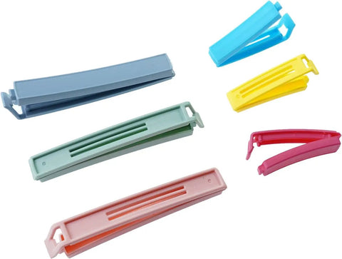 32 Piece Curved Plastic Bag Clips For Kitchen And Home Resealable Food Storage Sealers in assorted colors for sealing food.