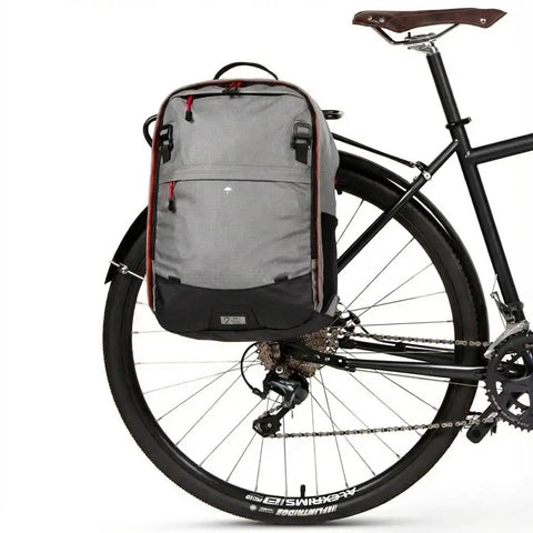Bike with Go-To Pannier Backpack Convertible Lite 22L Weatherproof 2-In-1 Bike Commuting And Laptop Travel Bag attached to rear rack
