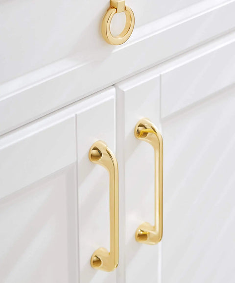 Top Shelf Heavy Gauge Zinc Alloy Cabinet Pulls Bow Handles Set Of Two Swanky Premium Electroplated Gold on white cabinets