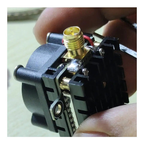 Close-up of SMA antenna connector on Beefed-Up 5.8 Gigahertz 2000mW FPV Transmitter for drones with lightweight heat sink.