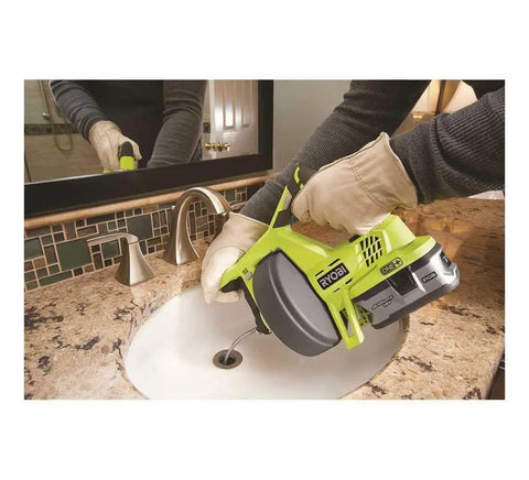 Person using 18V Cordless Drain Auger Tool Only P4001 For Quick Clog Busting Lightweight Electric Sewer Snake in sink