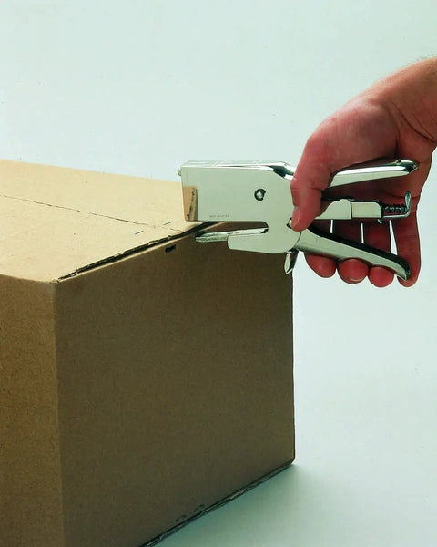 Heavy Duty Nickel Plated Staple Pliers With Attached Finger Stop and Standard Straight Anvil binding a cardboard box.
