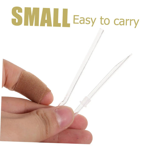 Small and easy to carry clear tool held in a hand with a bandaged finger, practical for various uses.