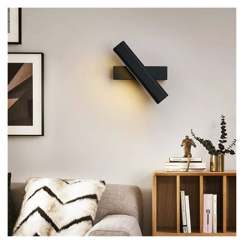 Elevate Your Home Vibe With This Sleek Black Metal Swivel Wall Sconce Led Lighting For Bedroom Living Room And Hallways Rustproof Adjustable Accent Lamp on a wall above a cozy sofa.