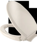 Soft Close Elongated Toilet Seat In Bone With Ergonomic Comfort Durable High Gloss Polypropylene Easy Mounting Hardware.
