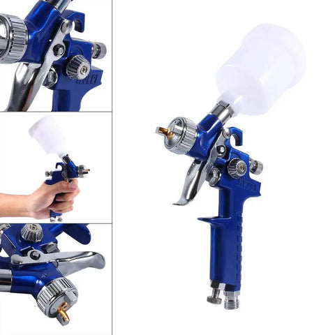 Precision Mini Gravity Feed HVLP Spray Paint Gun With 0.8mm Nozzle And 100ml Cup held in hand, showing detail orientation and nozzle.