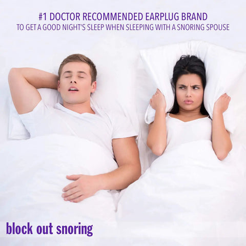 Man sleeping soundly next to awake woman, highlighting use of Slim Fit Foam Earplugs For Small Ears With Travel Case for snoring.