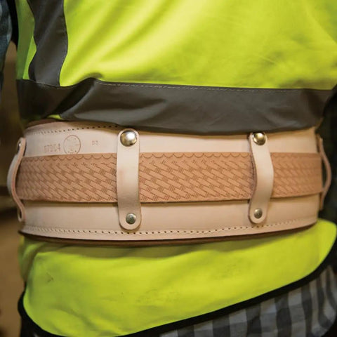 22-Inch Leather Cushion Belt Pad with Sponge-Padded Liner for Comfort in use on worker, showing heavy-duty stitching.