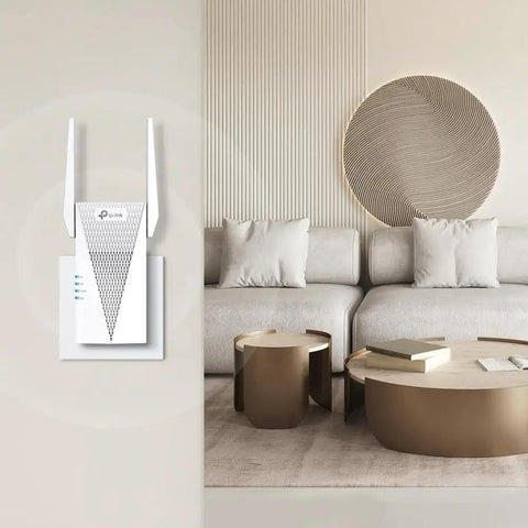 AX1800 WiFi 6 Range Extender With Ethernet Port Dual Band Repeater shown mounted on a living room wall