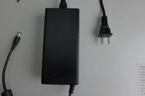 Universal Electric Bike Charger That Works With All Electric Bicycles Upgraded, UL Listed Safety on white background.