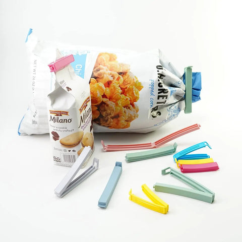 32 Piece Curved Plastic Bag Clips For Kitchen And Home Resealable Food Storage Sealers Lock In Freshness To Nuke Stale Leftovers Fast With A Rock Solid Grip That Holds Up All Week, assorted colors with snacks.