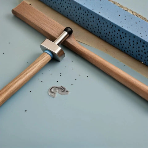 Sleek Plastic Fridge Door Stopper With Reliable Catch Hook For Modern Kitchens, showing a silver latch with a wooden handle.