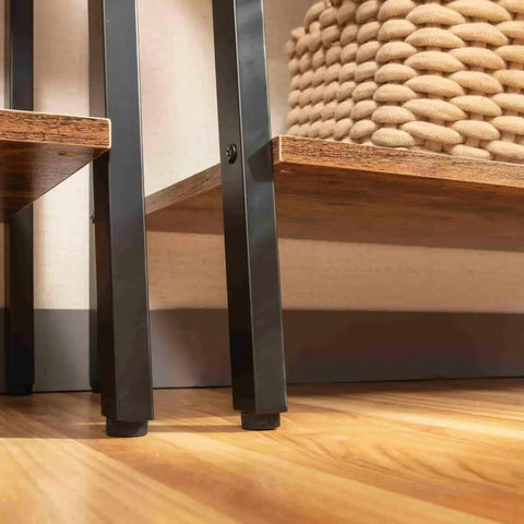 Close-up of adjustable feet on Dope Industrial Four Tier Freestanding Rustic Bookshelf Plant Stand Storage Rack.
