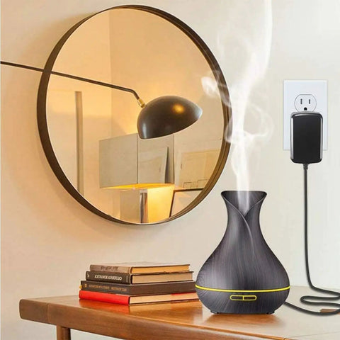 Living room scene with 24V 1A power adapter charger for LED strips, fish tanks, massage guns and more connected to wall outlet