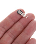 Close-up of MECCANIXITY FSR-400sB thin-film pressure sensor disk with two metal leads