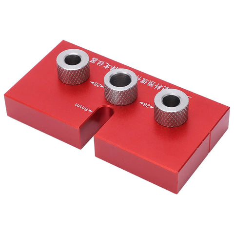 Top Shelf Wood Doweling Jig Drill Kit With Spot On Scaling Ruler And Rugged Aluminum Frame For Hassle Free Furniture Joinery And Cabinet Refinishing Projects Built Damn Tough And Ready For Work Red, showing three bushings on a red base.