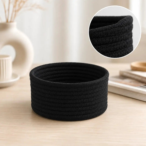 Super Handy Small Woven Cotton Rope Basket For Versatile Home Organization Black Storage Bin atop a wooden surface.