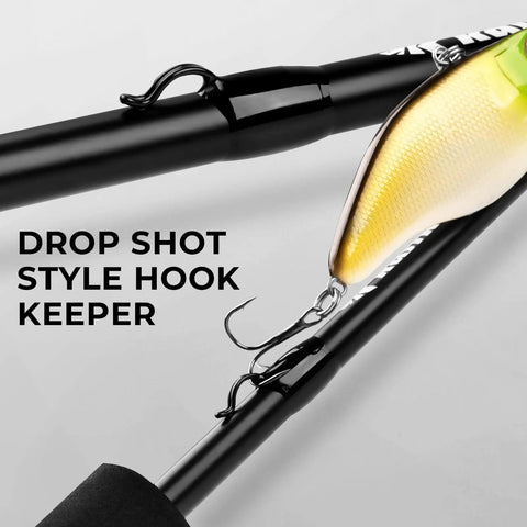 Close-up of Crixus Casting Rod 7 Foot Two Piece Medium Heavy Fast Action Fishing Rod with drop shot style hook keeper and lure attached.