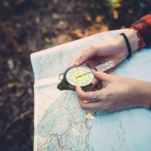 Person using Handy Mini Map Measurer For Hiking And Travel, Old School Rolling Distance Tool With A Metal Wheel on a map