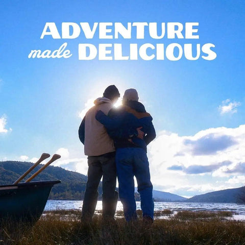 Two people embracing near water with a boat, "Adventure Made Delicious" text above, Freeze Dried Rice And Chicken With Carrots Celery And Red Peppers Emergency Canned Meal Pack For Camping And Survival Gluten Free Dairy Free 54 Servings Across Six Cans Nine Servings Each 30 Year Shelf Life Easy Prep Long Term Storage