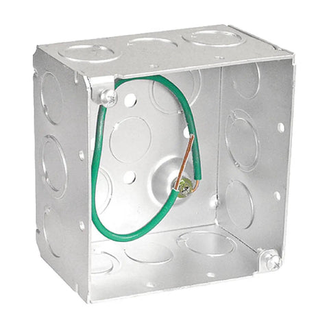 Metal electrical junction box with green grounding wire inside, side view.