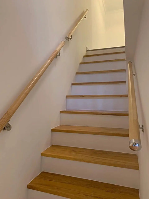 Heavy Duty Built Tough Non Slip PVC Handrail 18 Feet Long All Weather Deck Railing Kit With Easy Install Wall Brackets Wood Tone Finish, installed on indoor stairs.
