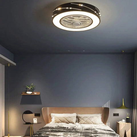 Sleek Minimalist Black Ceiling Fan With Three Speed Airflow And Three Color Dimming For Bedrooms And Offices providing quiet cooling above a bed.