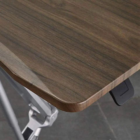 Close-up of the walnut surface on the Totally Adjustable Pneumatic Sit Stand Rolling Laptop Desk Cart, showcasing smooth edges.