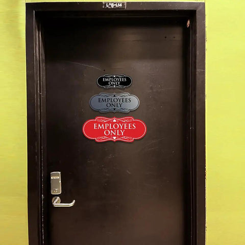 Door with multiple Employees Only signs in various colors and designs. Ideal for marking restricted areas in busy workspaces.