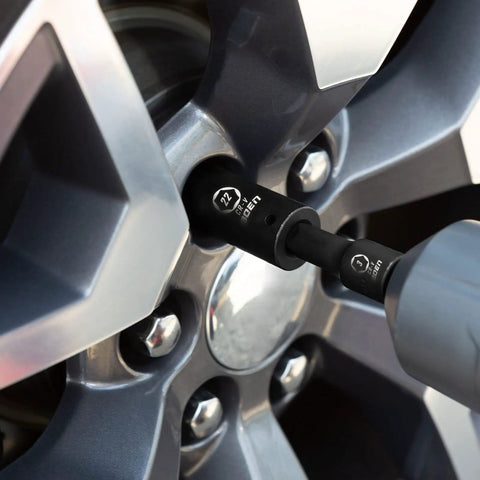 One Half Inch Drive Deep Impact Socket Set, 20 Piece CR V Steel Metric Sockets 10mm Through 24mm in use on car wheel