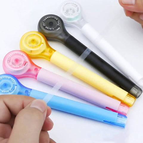Smooth As Butter Pen Style Correction Tape Rollers With Zero Stink And Zero Drama Glide For Fast Edits Portable Mini White Out Erasers in assorted colors.