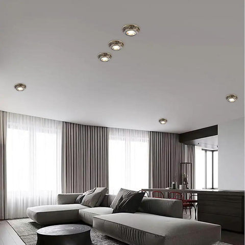 Ten Pack Brushed Brass Led Downlights 10 Watt Dimmable Eyeball Spotlights in modern living room ceiling setup.