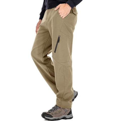 Model wearing mens waterproof hiking pants with fleece lined insulated soft shell for winter, visible side pocket zip detail.