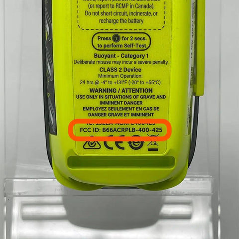 Bottom view of Rock Solid Gps Personal Locator Beacon Emergency Survival Kit with safety warnings and FCC ID details.